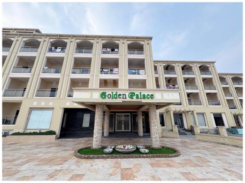a large building with a sign that reads golden palace at Private Beach Hotel Golden Palace with Swimming Pool in Puri in Puri