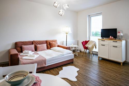 Ένα ή περισσότερα κρεβάτια σε δωμάτιο στο Apartament Różany