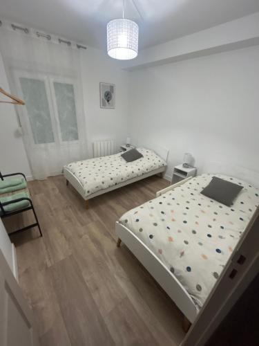 Ένα ή περισσότερα κρεβάτια σε δωμάτιο στο Maison Des Vignes