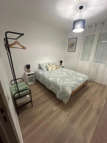 Ένα ή περισσότερα κρεβάτια σε δωμάτιο στο Maison Des Vignes