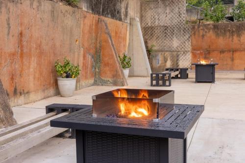 a fire pit in a courtyard with some plants at Historic DTWN Studio, Walk to Bathhouses, Shops, Room # 103 in Hot Springs