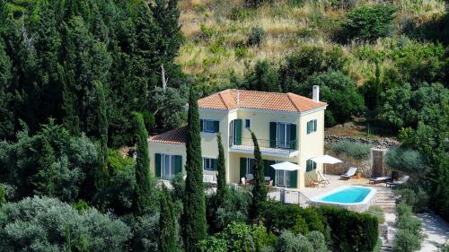 an aerial view of a villa with a swimming pool at Boo Premium Living Villas in Tsoukaladhes