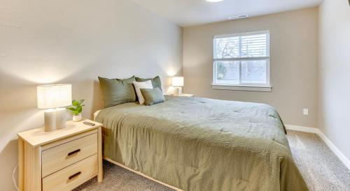 a bedroom with a large bed and a window at Boise Blue Retreat - North End - Hot Tub - 13 St in Garden City