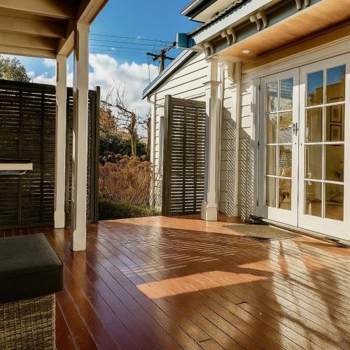 an empty porch of a house with a wooden floor at Central Blenheim Villa in Blenheim