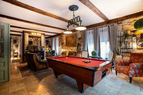 a living room with a pool table in it at Veritas in Tokaj