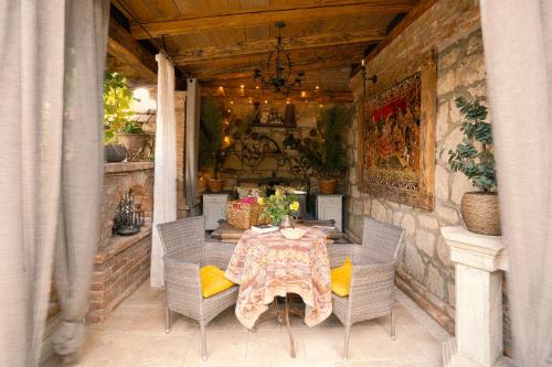 a table and chairs on an outdoor patio at Veritas in Tokaj