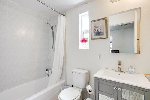 a white bathroom with a sink and a toilet at 5 Mi to Dtwn Oakland Studio with Shared Patio in Oakland