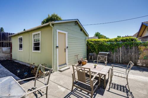 a patio with a table and chairs and a small shed at 5 Mi to Dtwn Oakland Studio with Shared Patio in Oakland