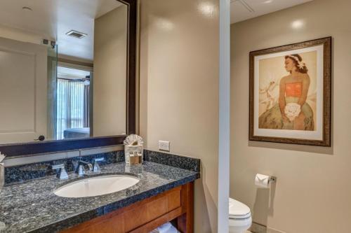 a bathroom with a sink and a mirror at KBM Resorts Ocean Views Mountain Views Spacious 4-Bedroom Honua Kai Collection Multi Unit Listing Same Floor 2 Free Rental Cars HKH-40934 in Kaanapali Airport