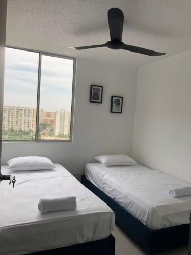 Ένα ή περισσότερα κρεβάτια σε δωμάτιο στο Apartmento, Barranquilla excelente ubicacion