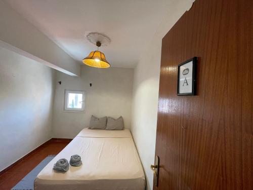 Postel nebo postele na pokoji v ubytování Olympo Shared flat with Amazing River view