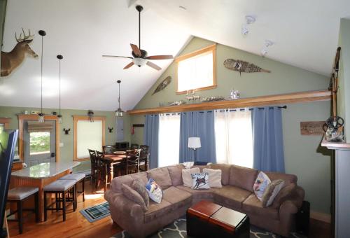 a living room with a couch and a table at Finley Lodge in Cooks Crossing