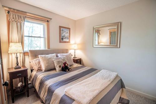 a bedroom with a bed with a teddy bear on it at Finley Lodge in Cooks Crossing