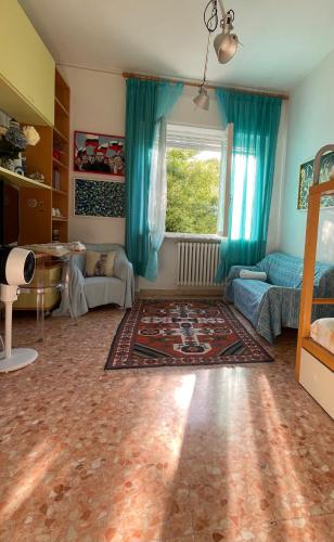 a living room with a couch and a window at Ars in Villa in Livorno