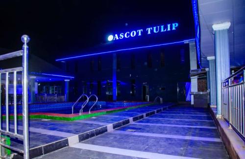 a building with a sign that reads aasconculosisccess at Ascot Tulip Hotel in Enugu