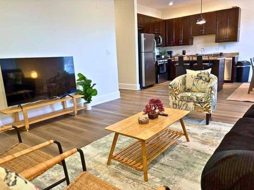 a living room with a couch and a table at Well-Equipped 2BR Unit with Parking - GBay 301 in Evanston