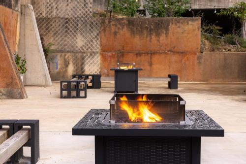 a fire pit in a courtyard with benches at Steps to Bathhouses, Restaurants, Heart of Downtown, Room # 301 in Hot Springs