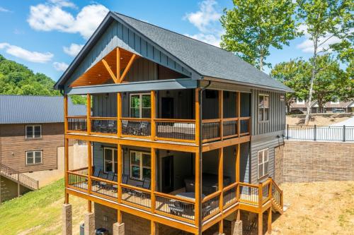 a house with a gambrel roof at Hilltop Haven By Avada Properties in Boyds Creek