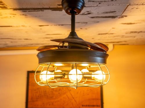 a chandelier hanging from a ceiling in a room at BurgBnB Downtown in Harrisburg