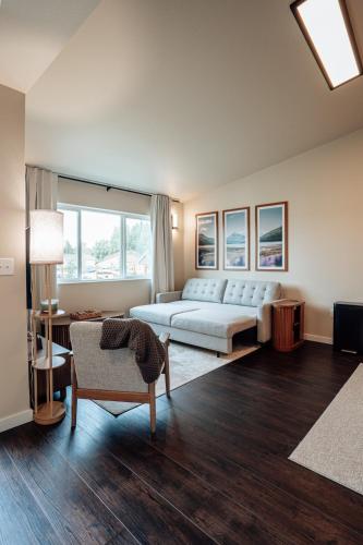 a large living room with a bed and a couch at Prime Eagle River Stay - Walkable Location in Eagle River