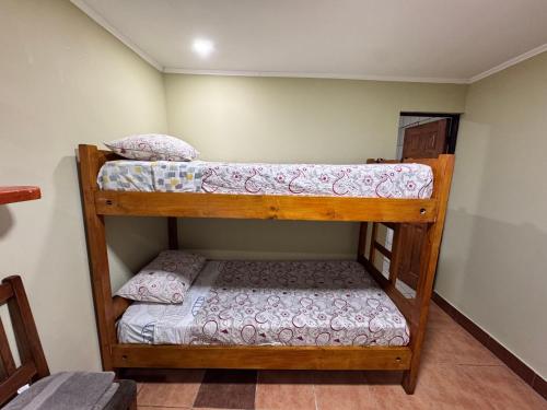 two bunk beds in a small room with at Residencial Don Santiago in Talca