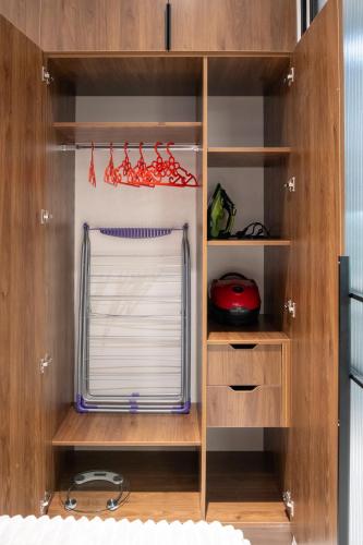 a closet with a window with a blinds at Nest One Luxe, Элитные апартаменты с балконом и видом на фонтан Tashkent City Park 077 in Tashkent