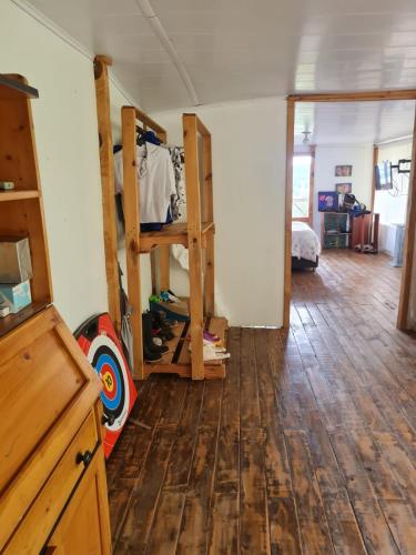 a room with two bunk beds and a wooden floor at Chalet Montaña Tenjo Mirador in Tenjo