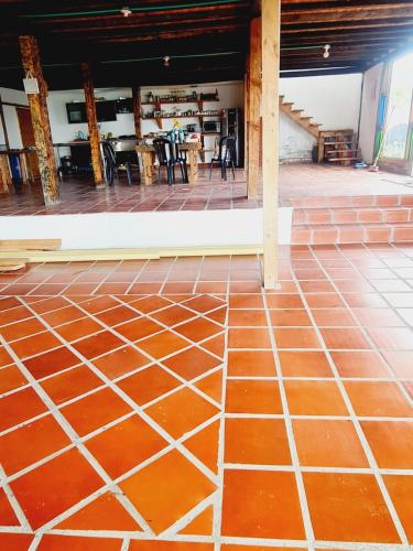 a tile floor in a room with a table at Chalet Montaña Tenjo Mirador in Tenjo