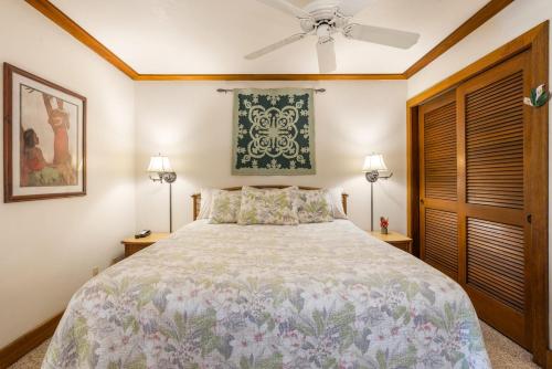 a bedroom with a bed and a ceiling fan at Kiahuna Plantation 323 in Kipu
