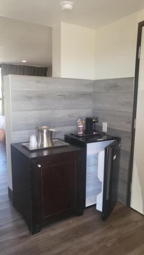 a kitchen with a counter with a sink in it at Valley Inn in Mission Hills