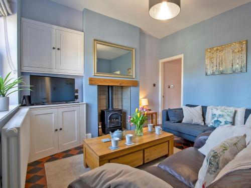 a living room with a couch and a table at 3 Bed in Bakewell 90384 in Bakewell
