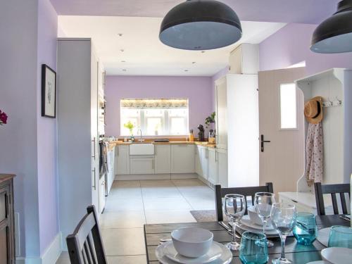 a kitchen and dining room with a table and chairs at 3 Bed in Bakewell 90384 in Bakewell