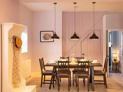 a dining room with a table and chairs at 3 Bed in Bakewell 90384 in Bakewell