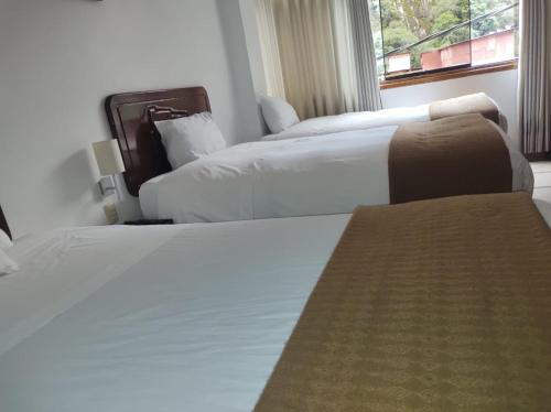Cama o camas de una habitación en Selvaterra MachuPicchu