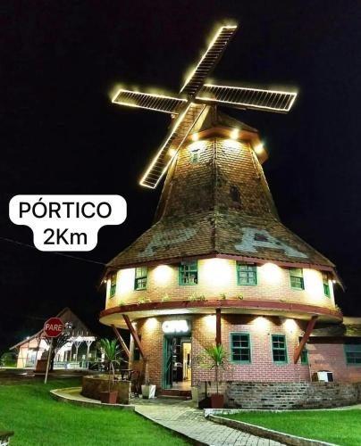 a building with a windmill on top of it at Casa Joinville in Joinville