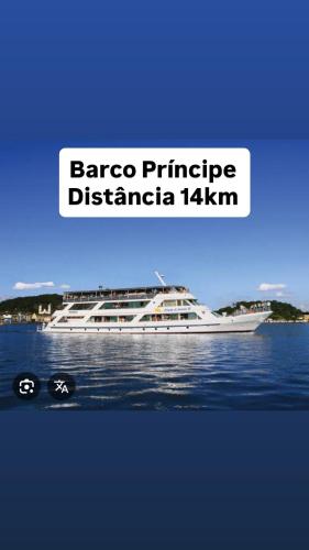 a white boat on the water with the words baroco principle detroitica at Casa Joinville in Joinville