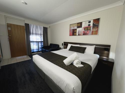 Katil atau katil-katil dalam bilik di Golden West Motor Inn
