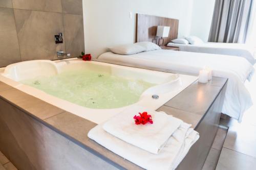 Ένα ή περισσότερα κρεβάτια σε δωμάτιο στο Zakua Gardens