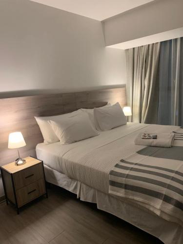 Katil atau katil-katil dalam bilik di Urban Suites Apart Hotel