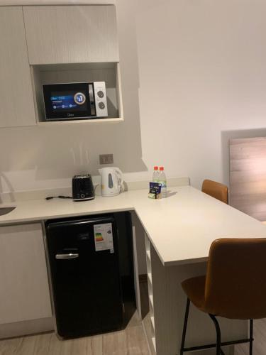Dapur atau dapur kecil di Urban Suites Apart Hotel