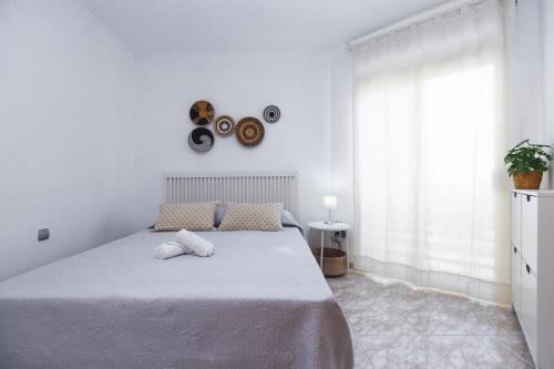 Кровать или кровати в номере FUENTE Apartment