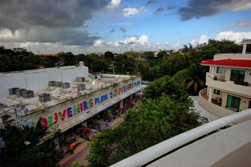 a building with a sign that reads we are the aid center at Palmar del Sol by Riviera Maya Suites in Playa del Carmen