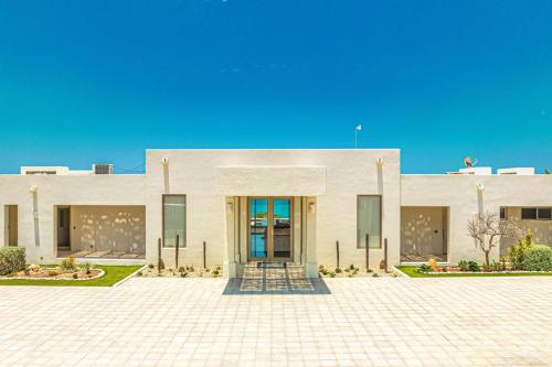 a building with a door in front of it at Casa Ali East Cape Luxury Villa by The Agency Baja in El Cardonal