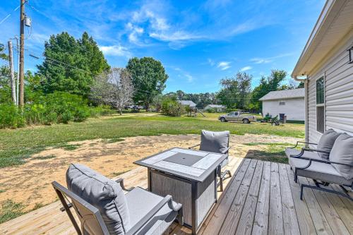 a patio with a table and chairs on a deck at 2 Mi to Marina and Lake Cumberland! Newly Built Home in Somerset