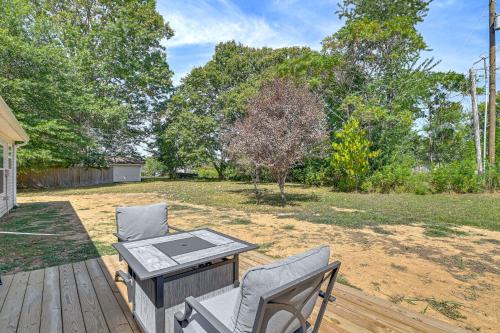 a patio with a table and two chairs on a deck at 2 Mi to Marina and Lake Cumberland! Newly Built Home in Somerset