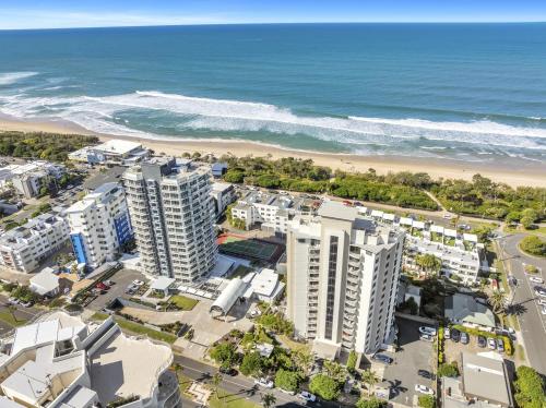 an aerial view of the beach and buildings at Catalina Resort in Maroochydore