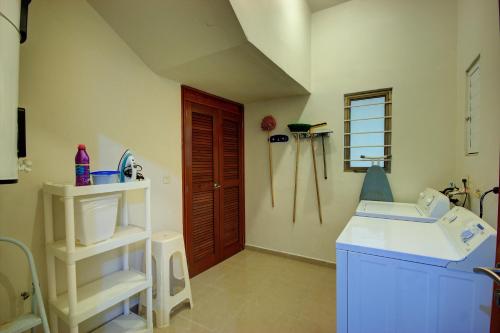 a small bathroom with a sink and a sink at Palmar del Sol by Riviera Maya Suites in Playa del Carmen