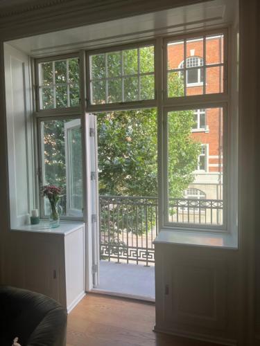 an open door with a view of a balcony at Topcity in Copenhagen