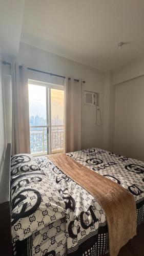 Ένα ή περισσότερα κρεβάτια σε δωμάτιο στο Aston Place 2 Bedroom