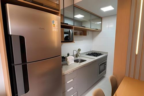 Dapur atau dapur kecil di Residencial Vivant - Perto de TUDO! LZN Hospedagens